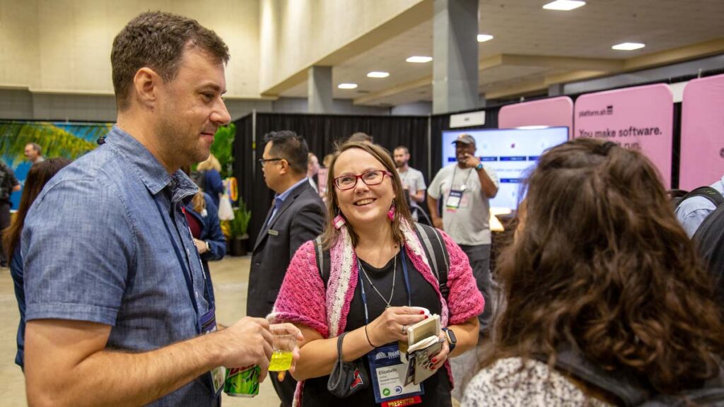 Attendees networking at the annual conference 