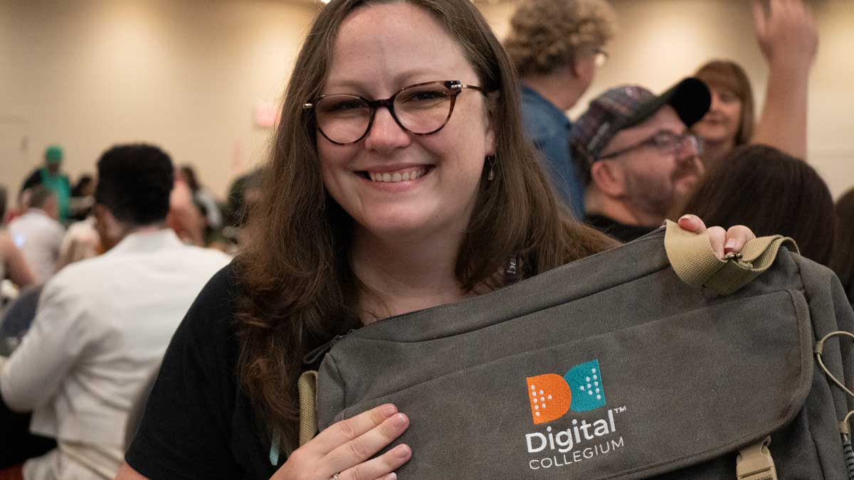 Member shows off her Digital Collegium branded satchel.