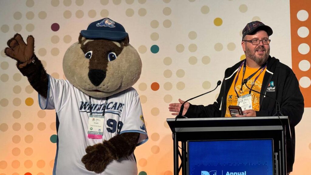 Tom Woj and the White Caps River Rascal greet attendees