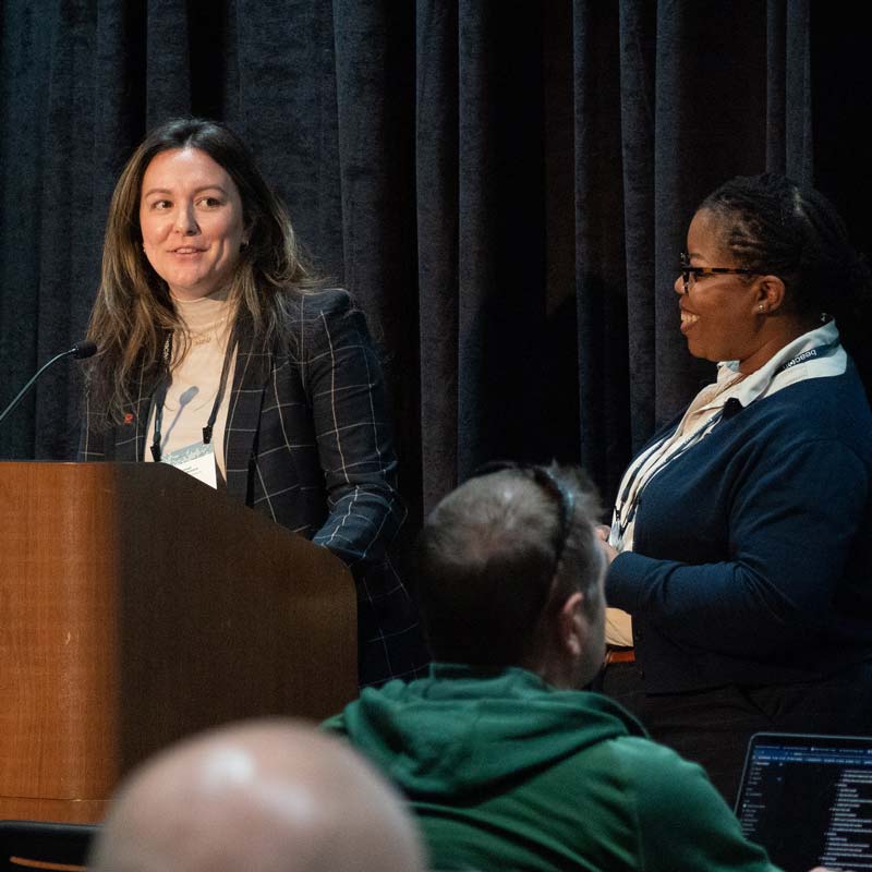 Presenter at podium during annual conference session